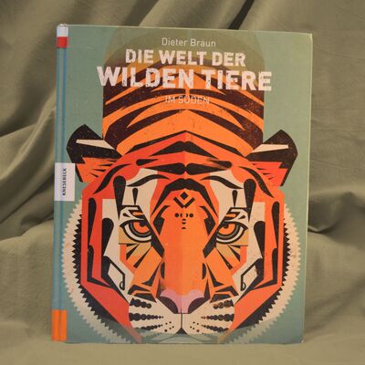 Foto des Buches "Die Welt der wilden Tiere im S&uuml;den". Der gezeichnete Tiger auf dem Buchcover sieht den Betrachter direkt an.