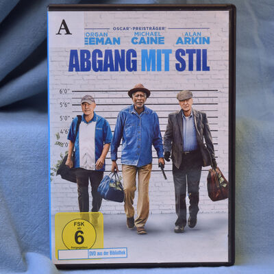Foto der DVD "Abgang mit Stil". Das Cover zeigt drei &auml;ltere Herren mit Tragetaschen voller Geld.